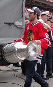 Andrew Shaw carrying the Stanley Cup